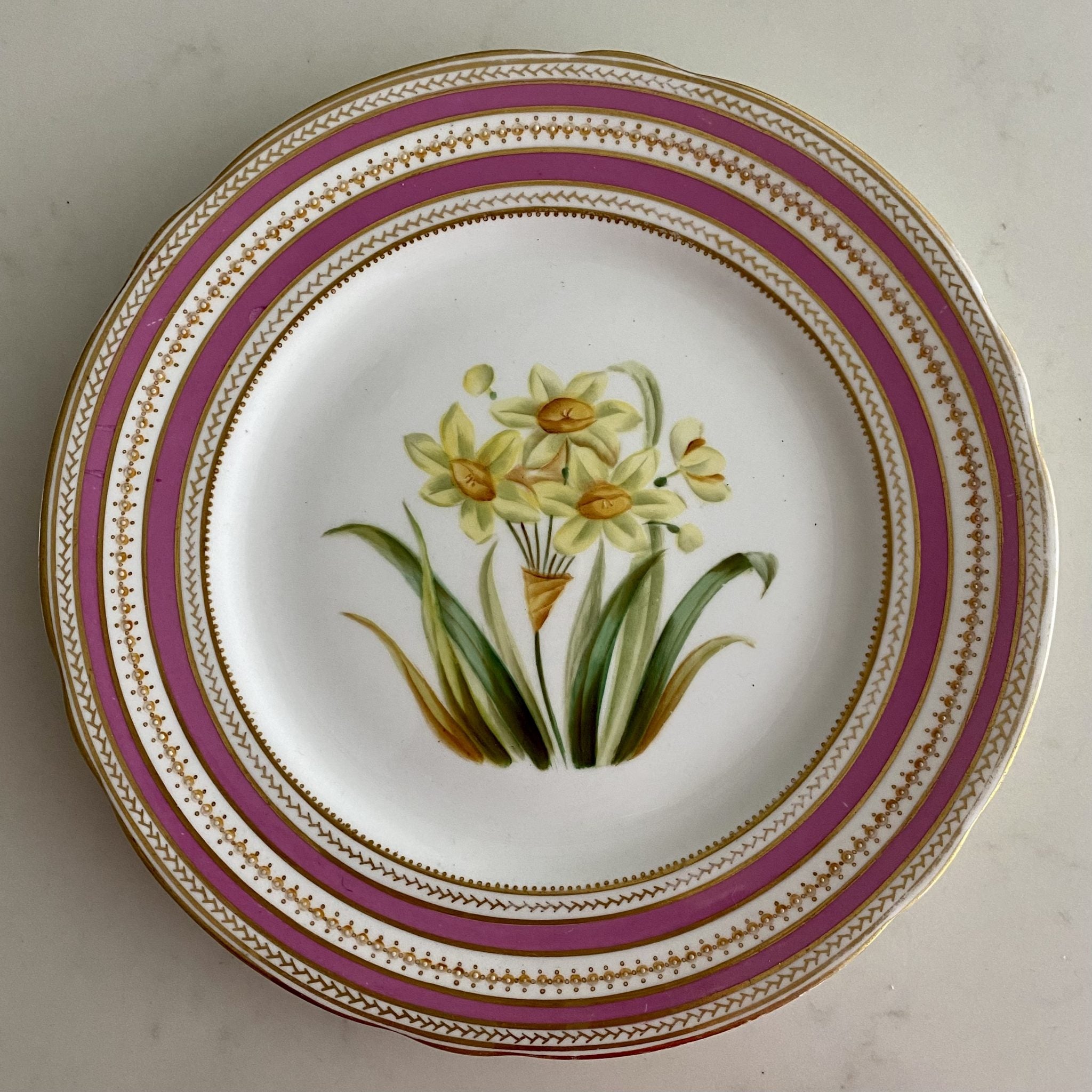 K96 SET 11 ANTIQUE PINK & GILT RIMMED HAND PAINTED FLOWER PLATES